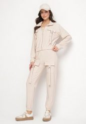 Jasnobeżowy Komplet Dresowy Bluza Rozpinana i Spodnie Slim w Stylu Utility Telavienna. Brązowe bluzy damskie Born2be, m, bez wzorów, z dresówki, bez kaptura. Za 84.99 zł.
