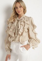 Beżowa Koszula z Wiskozą o Luźnym Kroju z Falbanami i Wiązaniem Ravionel. Brązowe koszule damskie Born2be, m, bez wzorów, z wiskozy, eleganckie, bez kołnierzyka, bez ramiączek. Za 169.99 zł.