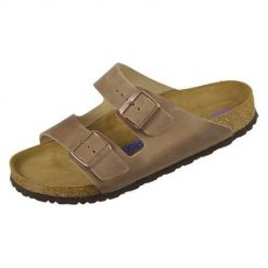 Klapki Birkenstock 552811. Brązowe klapki damskie Birkenstock, bez wzorów, z materiału, bez obcasa, bez zapięcia. Za 479.00 zł.