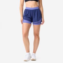 Spodenki fitness cardio damskie Domyos 2 w 1. Fioletowe spodenki sportowe damskie DOMYOS, l, bez wzorów, z materiału, na fitness i siłownię. Za 69.99 zł.