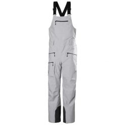Kombinezon narciarski damski z szelkami Helly Hansen Powderqueen 2.0. Szare kombinezony damskie Helly Hansen, bez wzorów, sportowe, bez kołnierzyka, bez ramiączek. Za 1,343.50 zł.