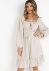 Beżowa Sukienka Auxede. Brązowe sukienki damskie Born2be, bez wzorów, z tkaniny, bez ramiączek. Za 119.99 zł.