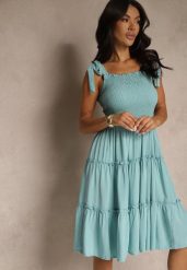 Jasnoniebieska Sukienka z Wiskozą o Rozkloszowanym Kroju na Ramiączkach z Wiązaniem Aranive. Niebieskie sukienki damskie Renee, bez wzorów, z wiskozy, eleganckie, bez ramiączek. Za 49.99 zł.