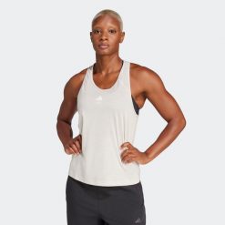 Koszulka fitness damska ADIDAS bez rękawów. Czerwone koszulki damskie Adidas, l, bez wzorów, z materiału, bez kołnierzyka, bez ramiączek. Za 99.99 zł.