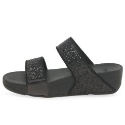 Kobiece klapki na koturnie FitFlop Lulu Slide. Czarne klapki damskie FIT FLOP, bez wzorów, bez obcasa, na koturnie, bez zapięcia. Za 484.50 zł.