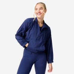 Bluza sportowa damska Domyos. Niebieskie bluzy damskie DOMYOS, s, bez wzorów, z elastanu, bez kaptura. Za 159.99 zł.