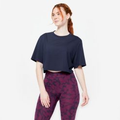 Koszulka damska Domyos Gym & Pilates crop top. Niebieskie bluzki damskie DOMYOS, xl, bez wzorów, z bawełny, sportowe, bez kołnierzyka, bez ramiączek. Za 49.99 zł.