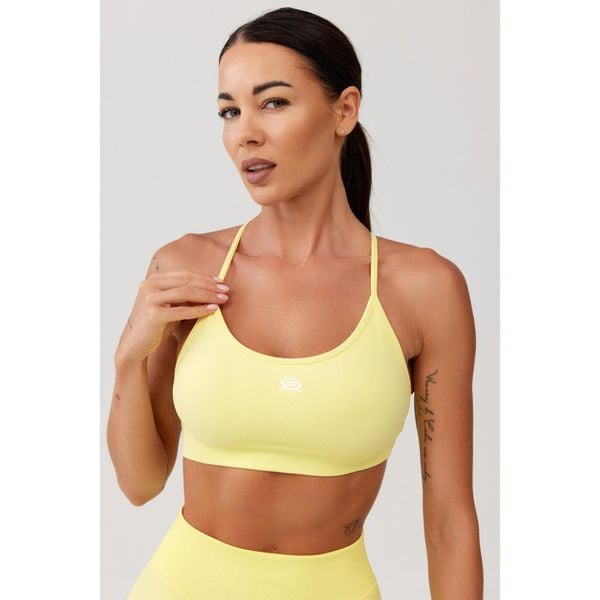 Stanik sportowy bezszwowy Rough Radical Seamless Glow Bra. Żółte biustonosze sportowe damskie ROUGH RADICAL, bez wzorów. W wyprzedaży za 103.92 zł.