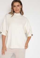 Jasnobeżowy Sweter Ozdobiony na Rękawach Cyrkoniami Aletusa. Brązowe swetry klasyczne damskie Born2be, z jeansu, bez kołnierzyka. Za 99.99 zł.