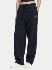 Tommy Hilfiger Spodnie dresowe Logo Exaggerated Seam WW0WW50783 Granatowy Relaxed Fit. Niebieskie spodnie dresowe damskie Tommy Hilfiger, s, bez wzorów, z bawełny. Za 649.99 zł.