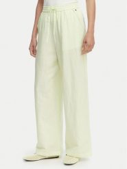 Tommy Jeans Spodnie materiałowe DW0DW22285 Zielony jasny Loose Fit. Zielone spodnie materiałowe damskie Tommy Jeans, bez wzorów, z jeansu. Za 409.99 zł.