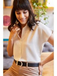 Olalook Bluzka "Olalook" w kolorze kremowym rozmiar: M. Brązowe bluzki damskie Olalook, m, bez wzorów, z wiskozy, bez kołnierzyka, bez ramiączek. Za 65.38 zł.