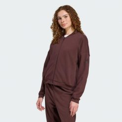 Kurtka Essentials Contemporary Logo Bomber. Brązowe kurtki damskie Adidas, bez wzorów, z materiału, bez kaptura. Za 279.00 zł.