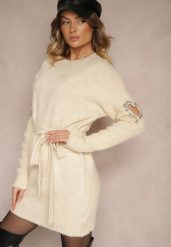 Beżowa Sukienka Sweterkowa z Wełną Ozdobiona Cyrkoniami Paskiem i Wycięciami Zolida. Brązowe sukienki damskie Renee, bez wzorów, z wełny, eleganckie, bez ramiączek. W wyprzedaży za 135.99 zł.