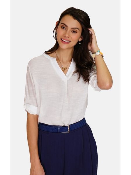 William de Faye Bluzka w kolorze białym rozmiar: 34. Białe bluzki damskie William de Faye, bez wzorów, klasyczne, bez kołnierzyka, bez ramiączek. Za 65.85 zł.