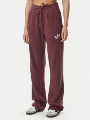Adidas Spodnie dresowe Essentials IA4436 Bordowy Loose Fit. Czerwone spodnie dresowe damskie Adidas, xs, bez wzorów, z dresówki. Za 298.99 zł.