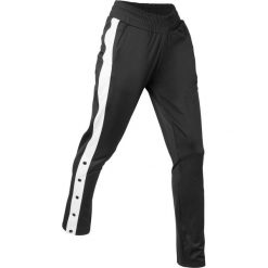 Spodnie sportowe, z rozpinanymi nogawkami, długie bonprix czarny. Czarne spodnie dresowe damskie bonprix, w paski. Za 89.99 zł.