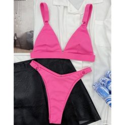 Strój kąpielowy z kółeczkami i regulowanymi ramiączkami na plażę i basen Shouko. Niebieskie stroje jednoczęściowe Intica, bez wzorów. Za 129.00 zł.