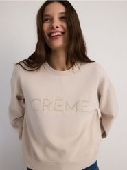 Bluza z haftem - beżowy. Brązowe bluzy damskie Reserved, l, bez wzorów, z dzianiny, bez kaptura. W wyprzedaży za 89.99 zł.