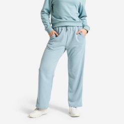 Spodnie dresowe damskie Domyos. Niebieskie spodnie sportowe damskie DOMYOS, l, bez wzorów, z dresówki, na fitness i siłownię. Za 69.99 zł.