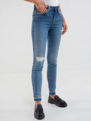 Jeansy damskie skinny z przetarciami niebieskie Adela 483. Niebieskie jeansy damskie Big Star, bez wzorów, z denimu. W wyprzedaży za 249.99 zł.