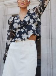 Milan Kiss Bluzka w kolorze czarnym rozmiar: L. Czarne bluzki damskie Milan Kiss, l, bez wzorów, bez kołnierzyka, bez ramiączek. Za 95.69 zł.