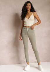 Ciemnozielone Spodnie Skinny Winvienne. Zielone rurki damskie Renee, w ażurowe wzory, z jeansu, z podwyższonym stanem. Za 49.99 zł.