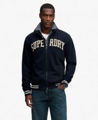 Superdry Kurtka treningowa Vintage Athletic, fason loose. Niebieskie kurtki damskie Superdry, s, z aplikacjami, bez kaptura. Za 408.75 zł.