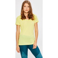 Under Armour - Top. Białe koszulki sportowe damskie Under Armour, z dzianiny, z krótkim rękawem. W wyprzedaży za 89.90 zł.