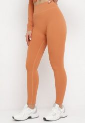 Pomarańczowe Legginsy z Elastycznej Prążkowanej Dzianiny Ichorsa. Brązowe legginsy damskie Born2be, s, bez wzorów, z dzianiny. Za 34.99 zł.
