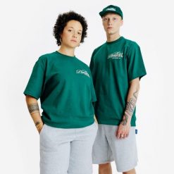 Koszulka z grafiką. Zielone koszulki damskie Decathlon, xl, bez wzorów, z bawełny, bez kołnierzyka, bez ramiączek. Za 89.99 zł.