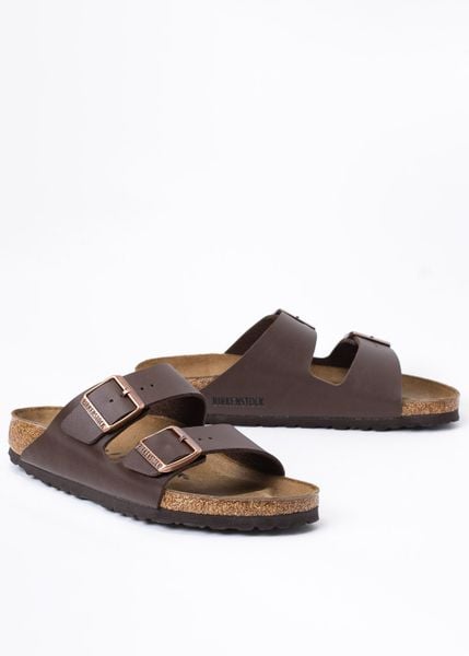 Birkenstock Arizona BS Klapki damskie. Brązowe klapki damskie Birkenstock, bez wzorów, bez obcasa, bez zapięcia. Za 349.99 zł.