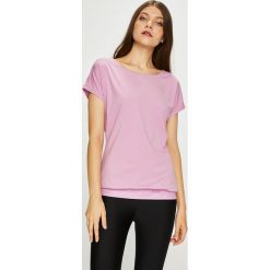 Puma - Top. Różowe koszulki sportowe damskie Puma, z dzianiny, z krótkim rękawem. Za 129.90 zł.