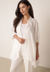 Biała Zwiewna Koszula Letnia Oversize z Bawełny o Nietoperzowym Kroju Canomela. Białe koszule damskie Born2be, na lato, l, bez wzorów, z bawełny, eleganckie, bez kołnierzyka, bez ramiączek. Za 139.99 zł.