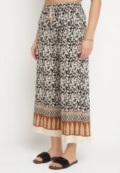 Czarne Bawełniane Spodnie z Wysokim Stanem o Długości 7/8 ze Wzorem Boho Lisavinea. Czarne spodnie materiałowe damskie Born2be, z aplikacjami, z bawełny. Za 29.99 zł.