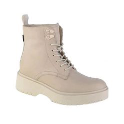 Beżowe skórzane buty Levi's Bria dla kobiet. Białe obuwie trekkingowe damskie Levi's, z materiału, bez zapięcia. Za 465.85 zł.