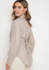Ciemnobeżowa Koszula z Usztywnionymi Ramionami Ozdobiona Sznurkiem Meroriela. Brązowe koszule damskie Born2be, uniwersalny, bez wzorów, z jeansu, eleganckie, bez kołnierzyka, bez ramiączek. Za 89.99 zł.