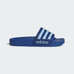 Klapki Adilette Shower. Niebieskie klapki damskie Adidas, bez wzorów, bez obcasa, bez zapięcia. Za 109.00 zł.