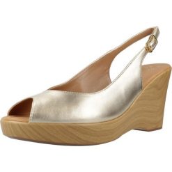 Sandały UNISA RACHEL LMT Złoty. Żółte sandały damskie Unisa, bez wzorów, ze skóry, bez obcasa, bez zapięcia. Za 389.99 zł.