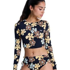 Krótka koszulka z długim rękawem rashguard damska THE BEACH BABE. Czarne bikini Roxy, bez wzorów, z elastanu. Za 259.99 zł.