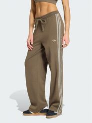 Adidas Spodnie dresowe Firebird KS7362 Brązowy Regular Fit. Brązowe spodnie dresowe damskie Adidas, xl, bez wzorów, z dresówki. Za 348.99 zł.
