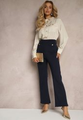 Granatowo-Beżowy Kombinezon z Koszulową Górą Zdobiony Wiązaniem i Eleganckimi Guzikami Eliti. Niebieskie sukienki damskie Renee, z aplikacjami, biznesowe, bez ramiączek. W wyprzedaży za 127.99 zł.