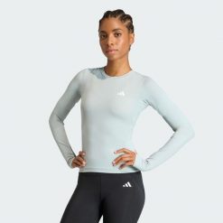 Koszulka Power Essentials Workout Contour Long Sleeve. Zielone koszulki damskie Adidas, bez wzorów, bez kołnierzyka, bez ramiączek. Za 149.00 zł.