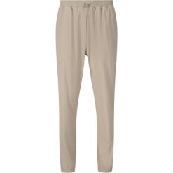 Damskie spodnie dresowe Athlecia Amisa. Brązowe spodnie dresowe damskie Athlecia, bez wzorów, z dresówki, na fitness i siłownię. Za 243.50 zł.