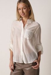 Jasnobeżowa Transparentna Koszula Ozdobiona Cyrkoniami Clymadia. Brązowe koszule damskie Born2be, l, bez wzorów, z jeansu, klasyczne, bez kołnierzyka, bez ramiączek. Za 79.99 zł.