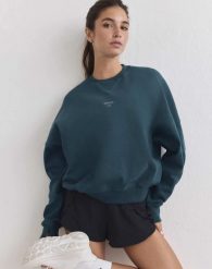 Damska bluza biegowa oddychająca, odprowadzająca wilgoć Le Run lagunowa. Zielone bluzy damskie Aim'n, xs, bez wzorów, z bawełny, bez kaptura. Za 387.00 zł.