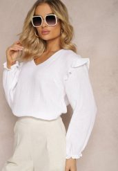 Biała Bawełniana Bluzka z Trójkątnym Dekoltem i Ozdobną Falbanką Redsta. Białe bluzki damskie Renee, xl, bez wzorów, z bawełny, eleganckie, bez kołnierzyka, bez ramiączek. Za 39.99 zł.