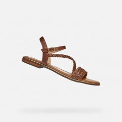 Sandały GEOX D55DQD Brązowy. Brązowe sandały damskie Geox, bez wzorów, ze skóry, bez obcasa, bez zapięcia. Za 330.99 zł.