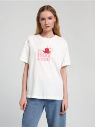 Koszulka Hot Stuff - kremowy. Białe koszulki damskie Sinsay, l, bez wzorów, z bawełny, bez kołnierzyka, bez ramiączek. Za 39.99 zł.