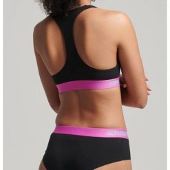 Biustonosz sportowy damski Superdry Offset Logo Crop. Czarne biustonosze sportowe damskie Superdry, bez wzorów, z bawełny. W wyprzedaży za 113.90 zł.
